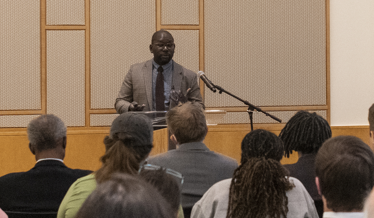 man at lecturn in main reading room