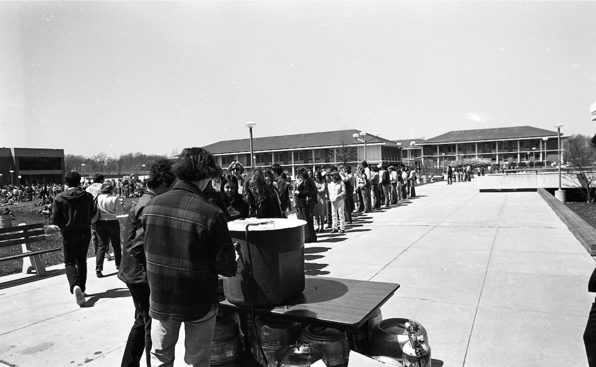 bw photo with a line of students