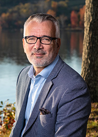 Headshot photo of Alp Ozerdem