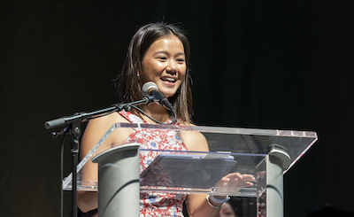 young woman at podium