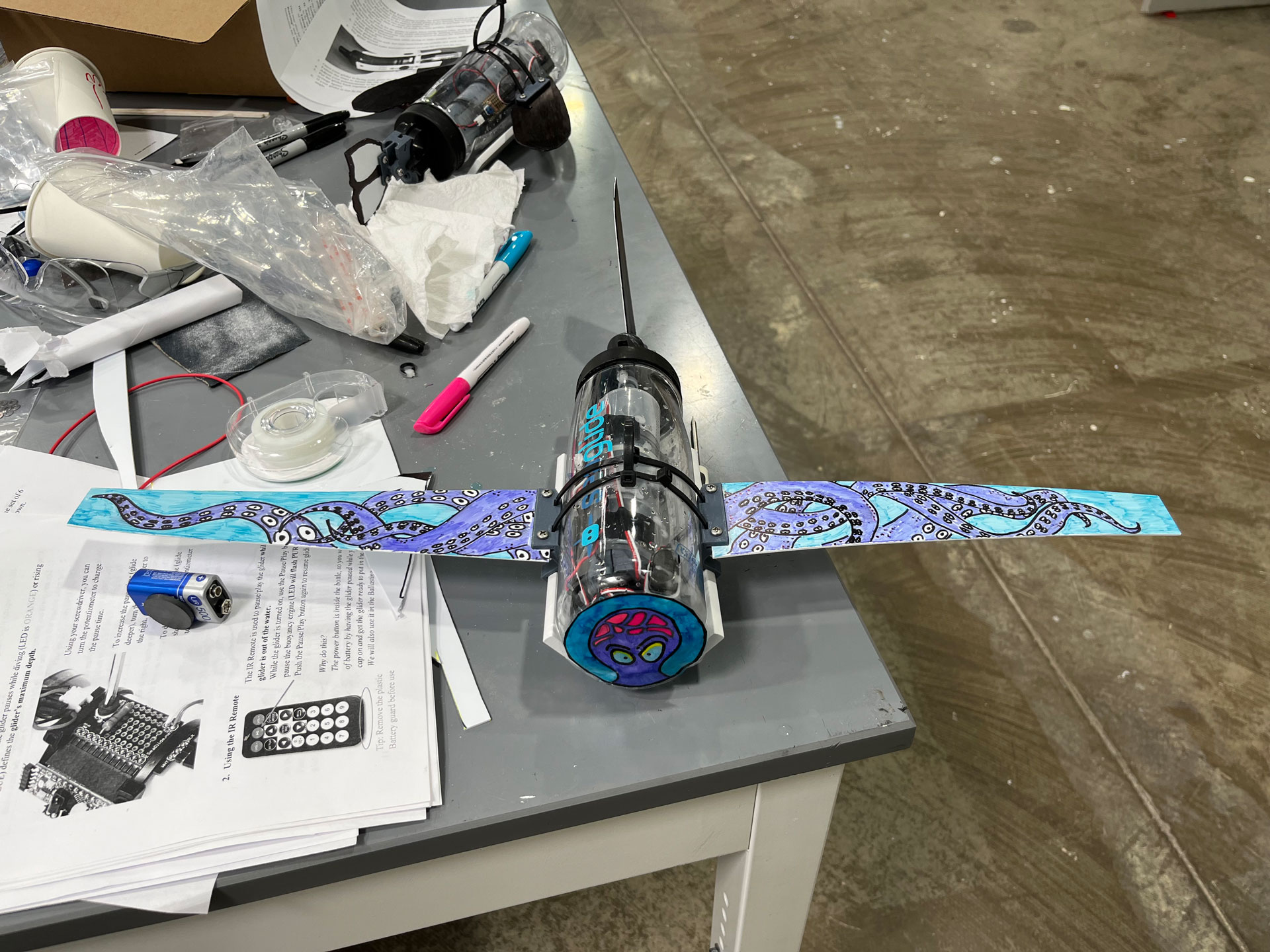 A remotely operated vehicle from the SeaGlide camp features two wings and a motor attached to a water bottle