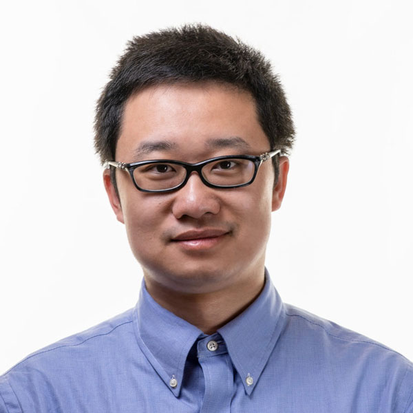 Xiaonan Guo wears a light-blue, collared shirt for his faculty profile in the IST department at Mason.