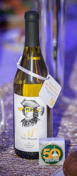 A bottle of Geo. Mason Chardonnay at the 50th Anniversary GMU Alumni Gala at Eagle Bank Arena in 2018. Photo Credit: John Boal Photography
